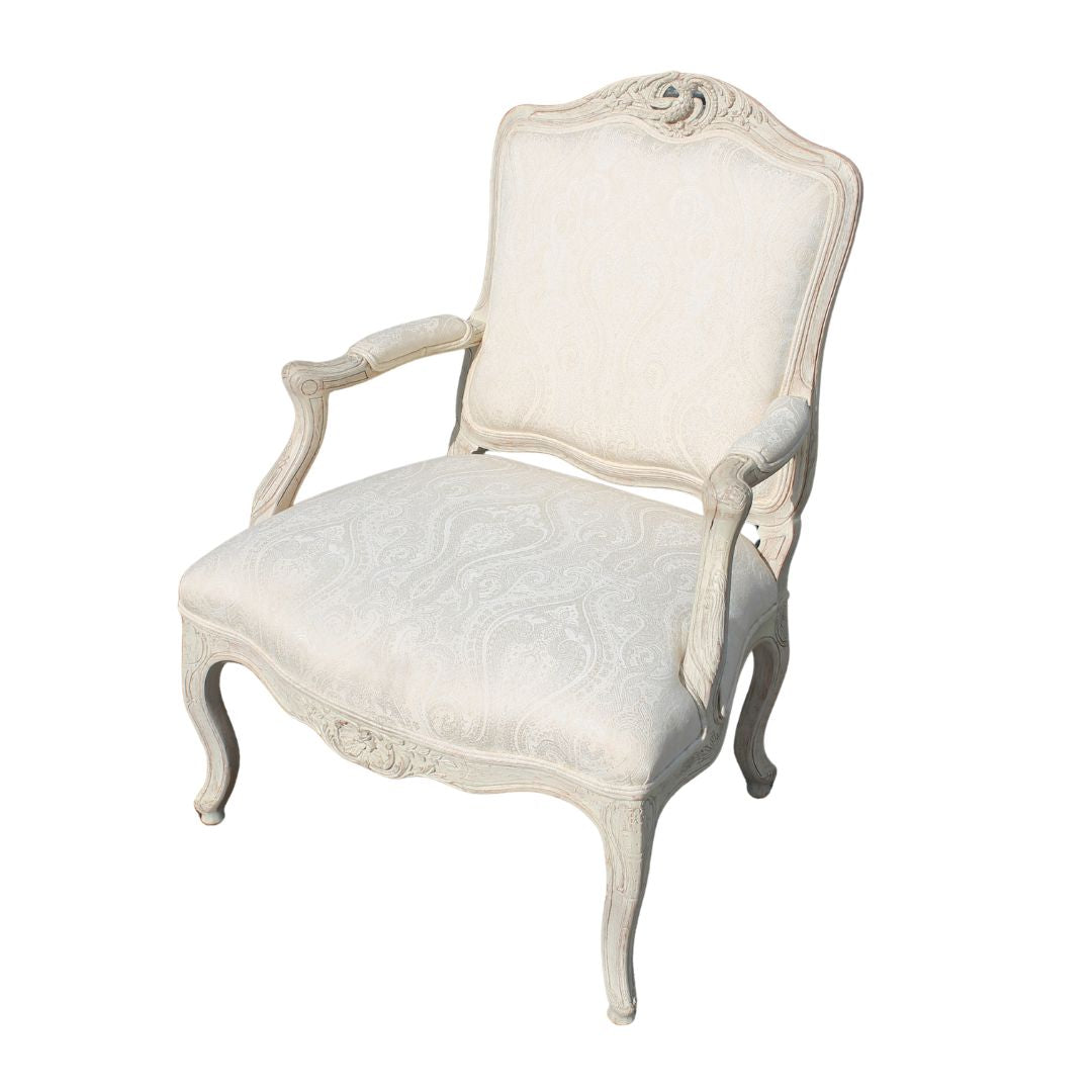 Bergere chair with bird carving