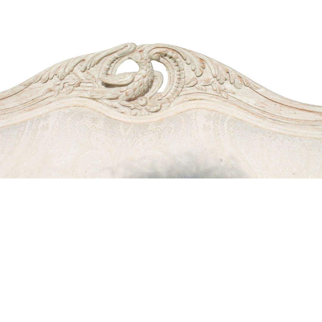 Bergere chair with bird carving