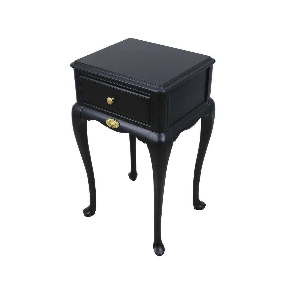 black night table with curvy legs