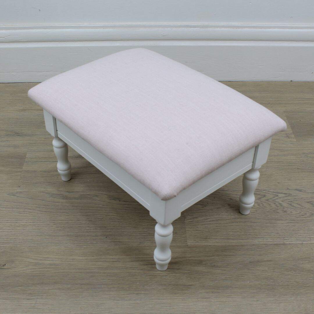 footstool with pink linen
