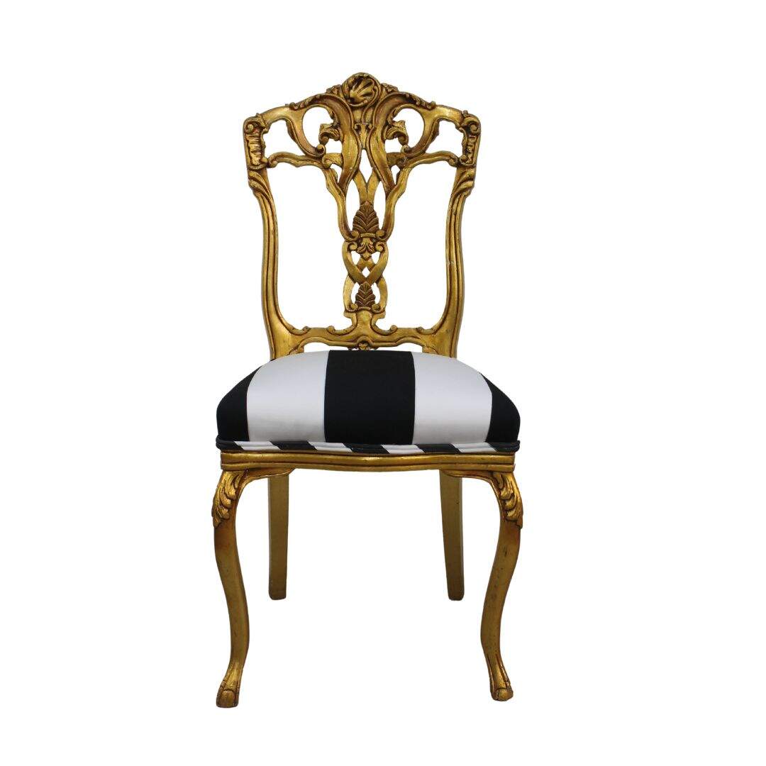 gold leaf chair with black and white stripes
