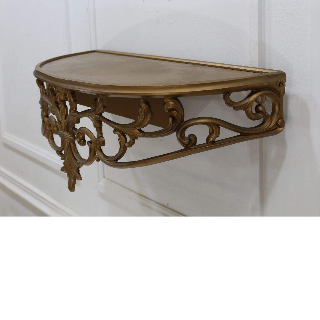 gold ornate wall shelf
