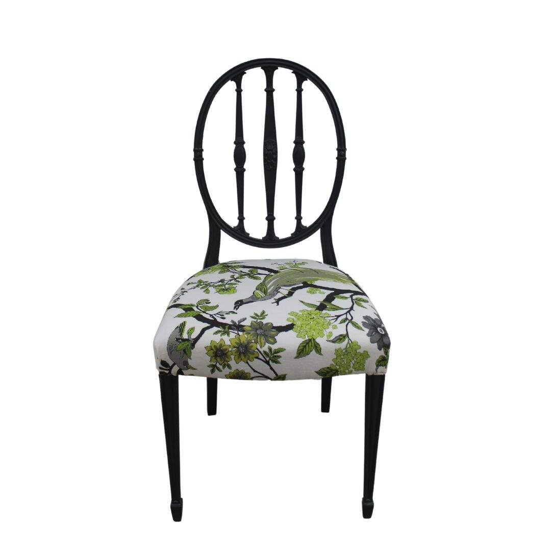 grey chair with bird fabric