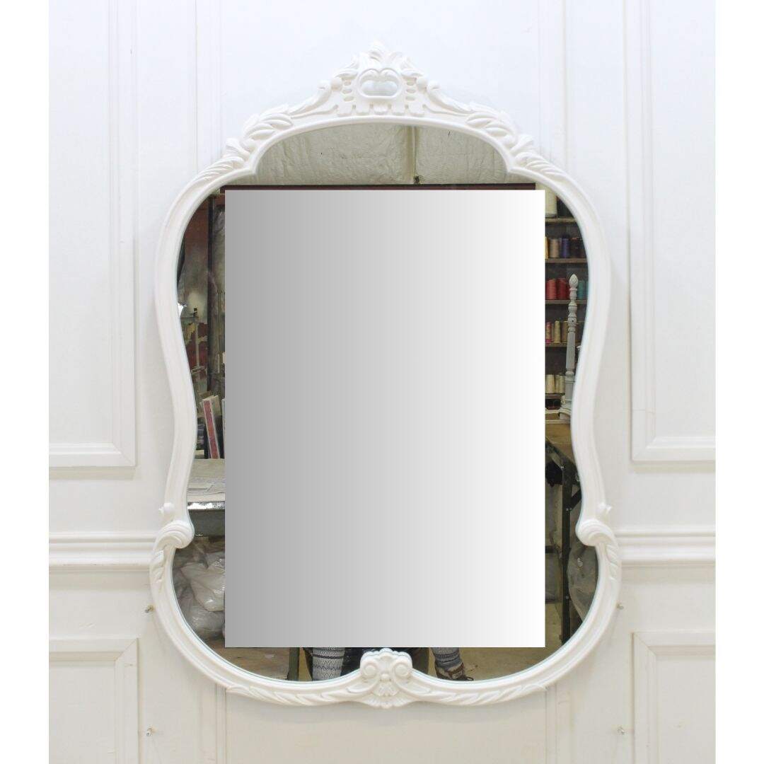 Ornate carved wooden mirror