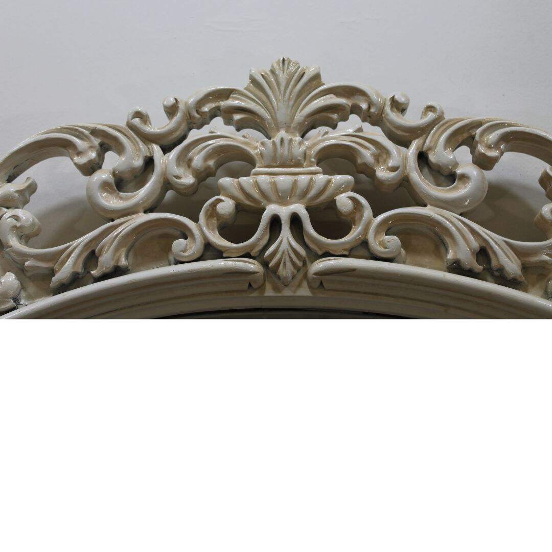 large ornate carved wooden mirror