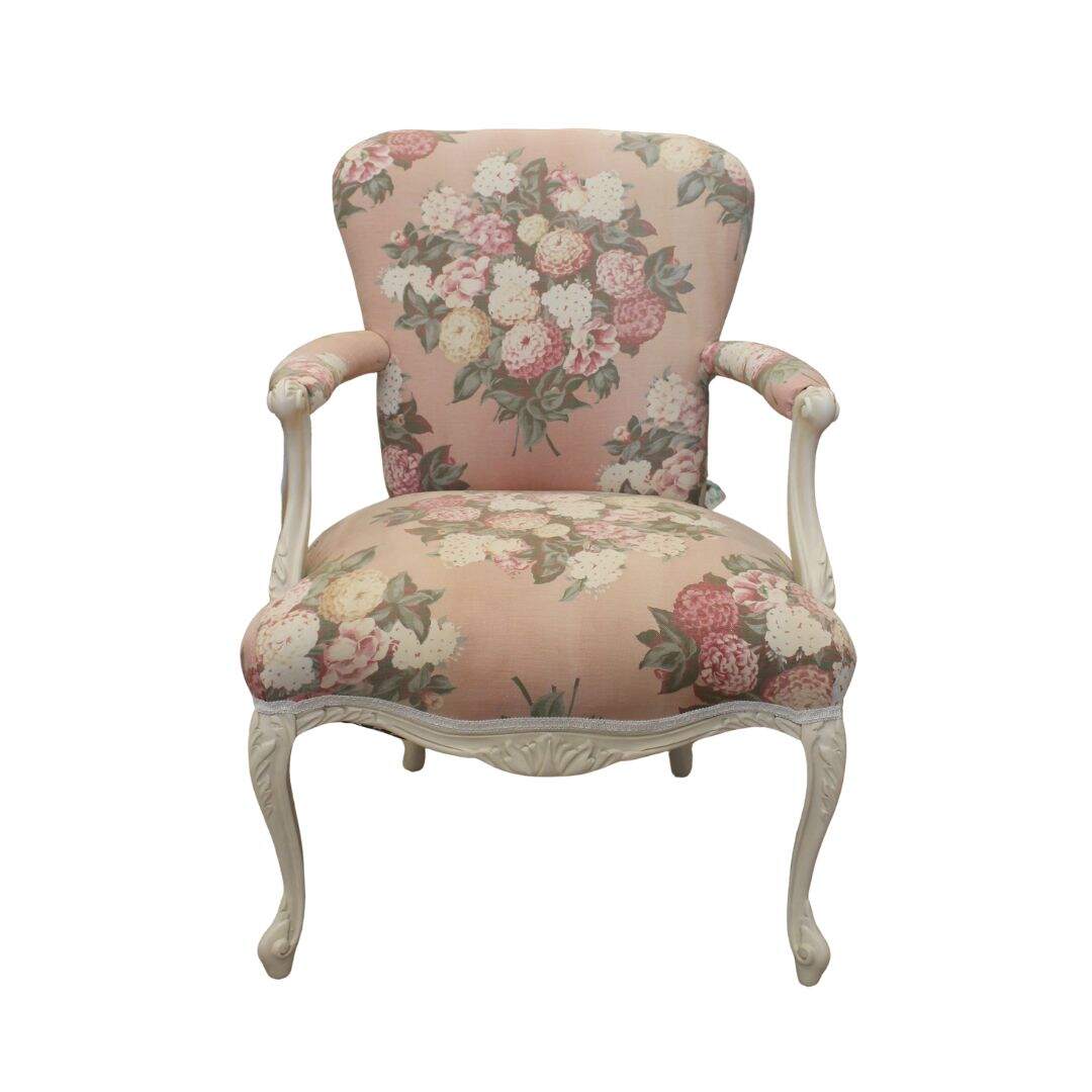 vintage chair with faded floral fabric