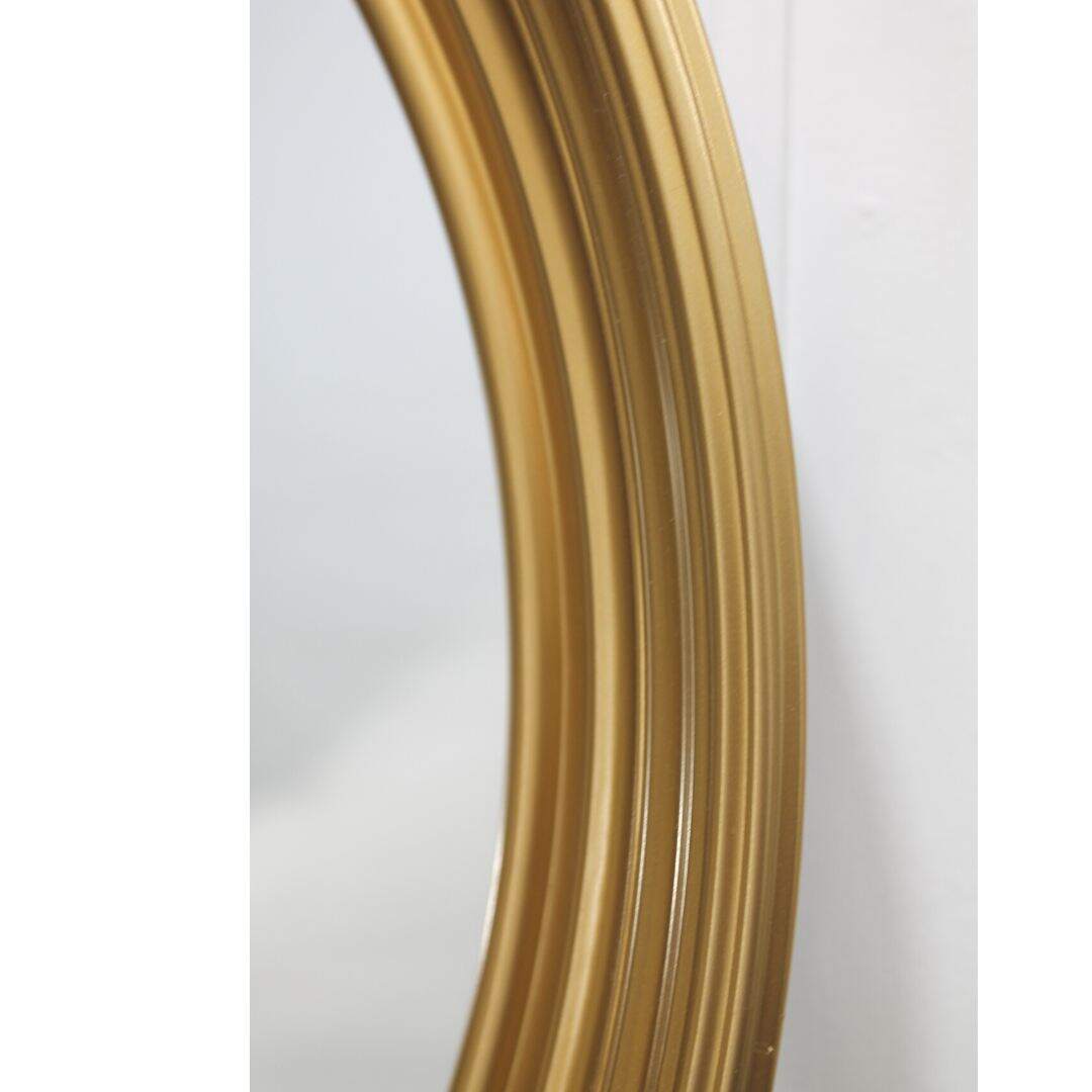 Round gold mirror