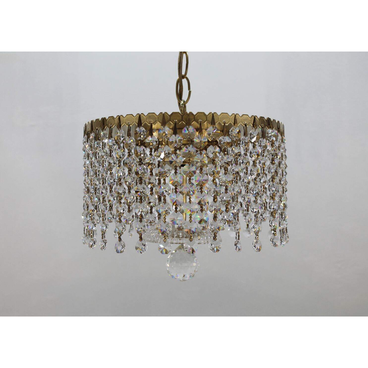 Round gold light fixture with crystals