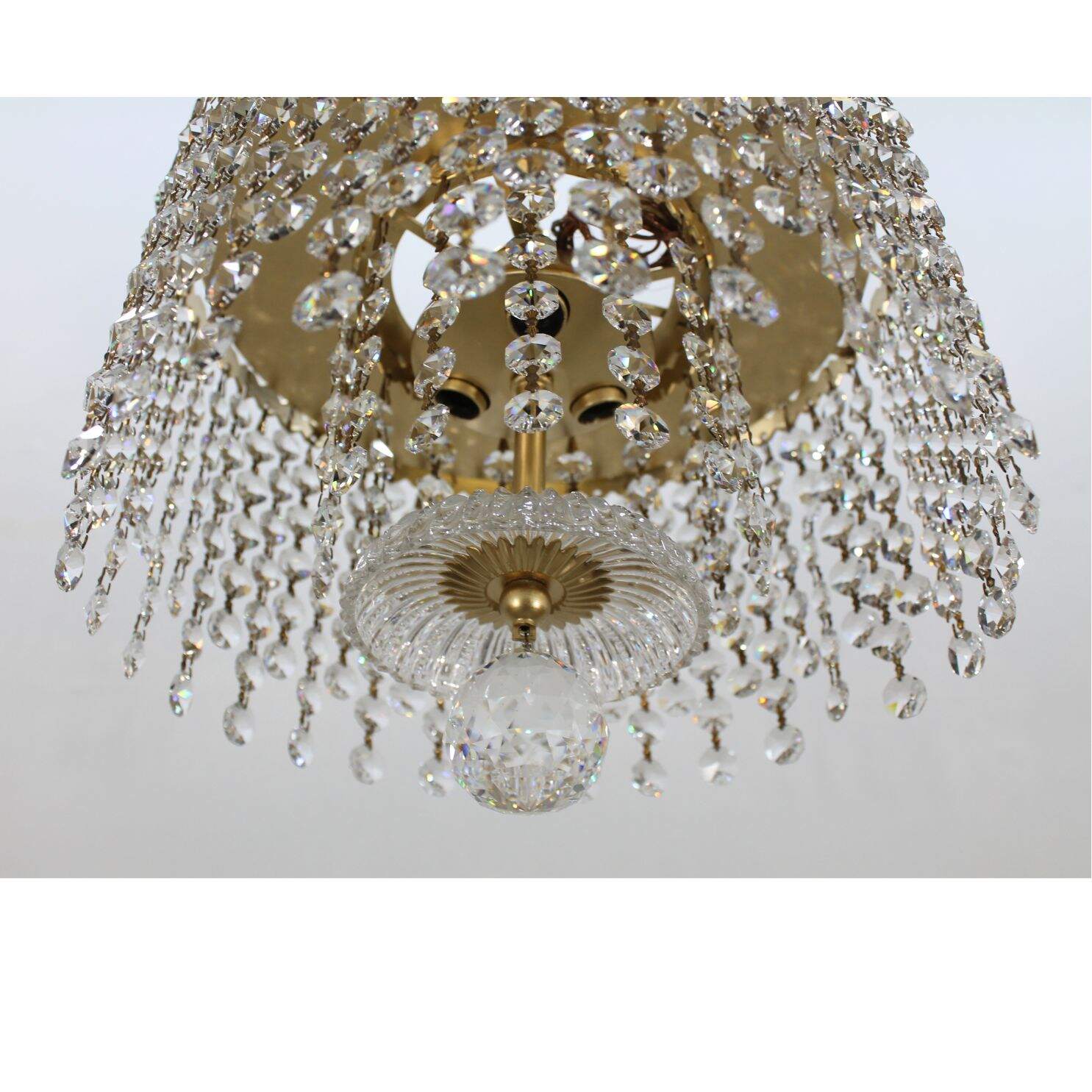 Round gold light fixture with crystals