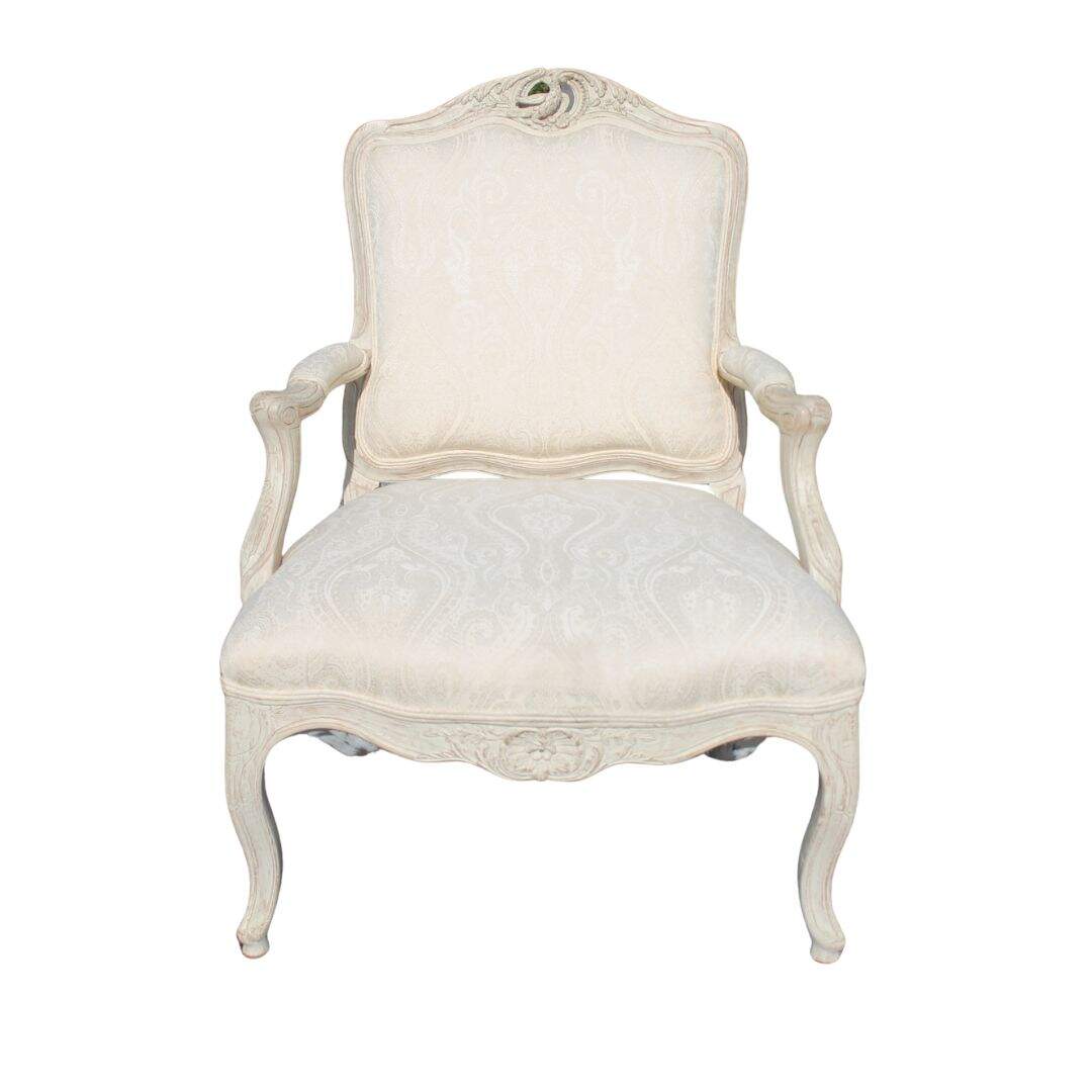 Bergere chair with bird carving