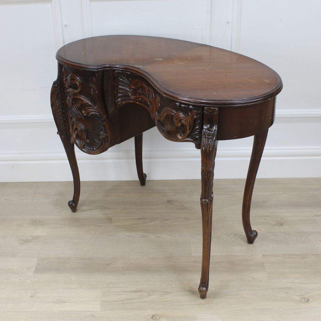 ornately carved asymmetrical vanity/desk, unpainted
