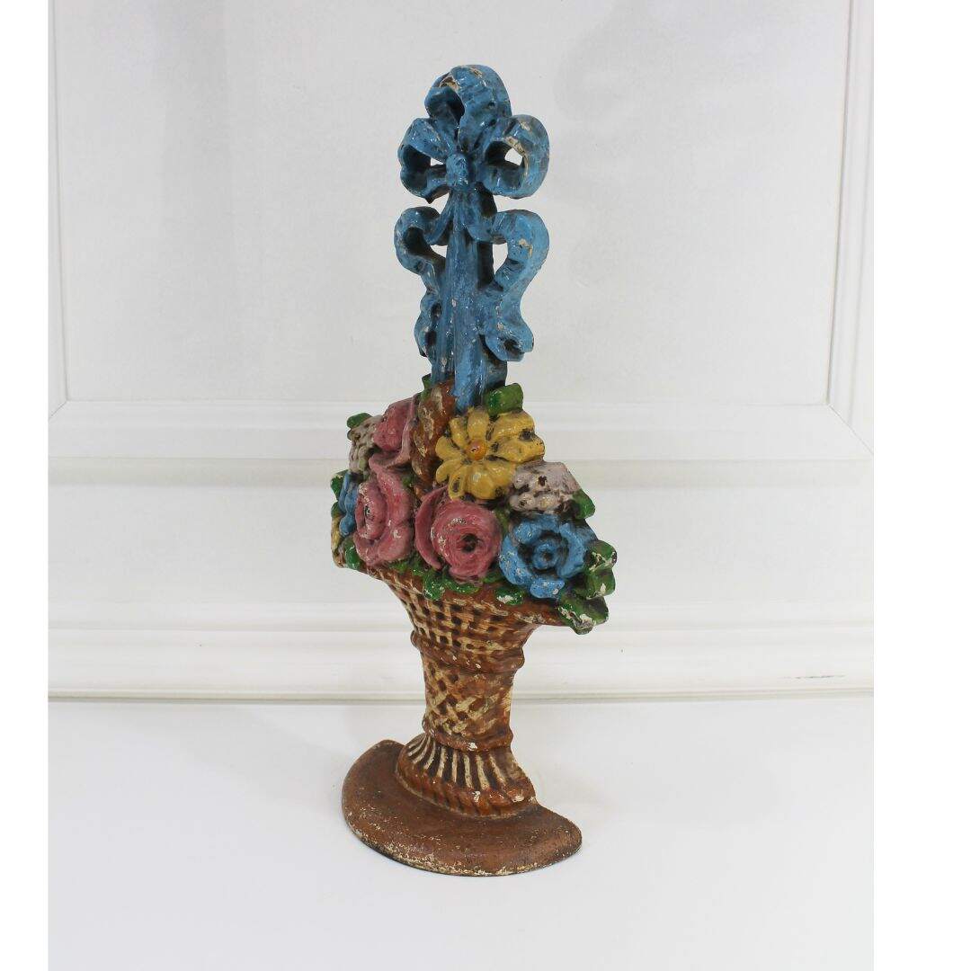 Antique floral basket cast iron door stop