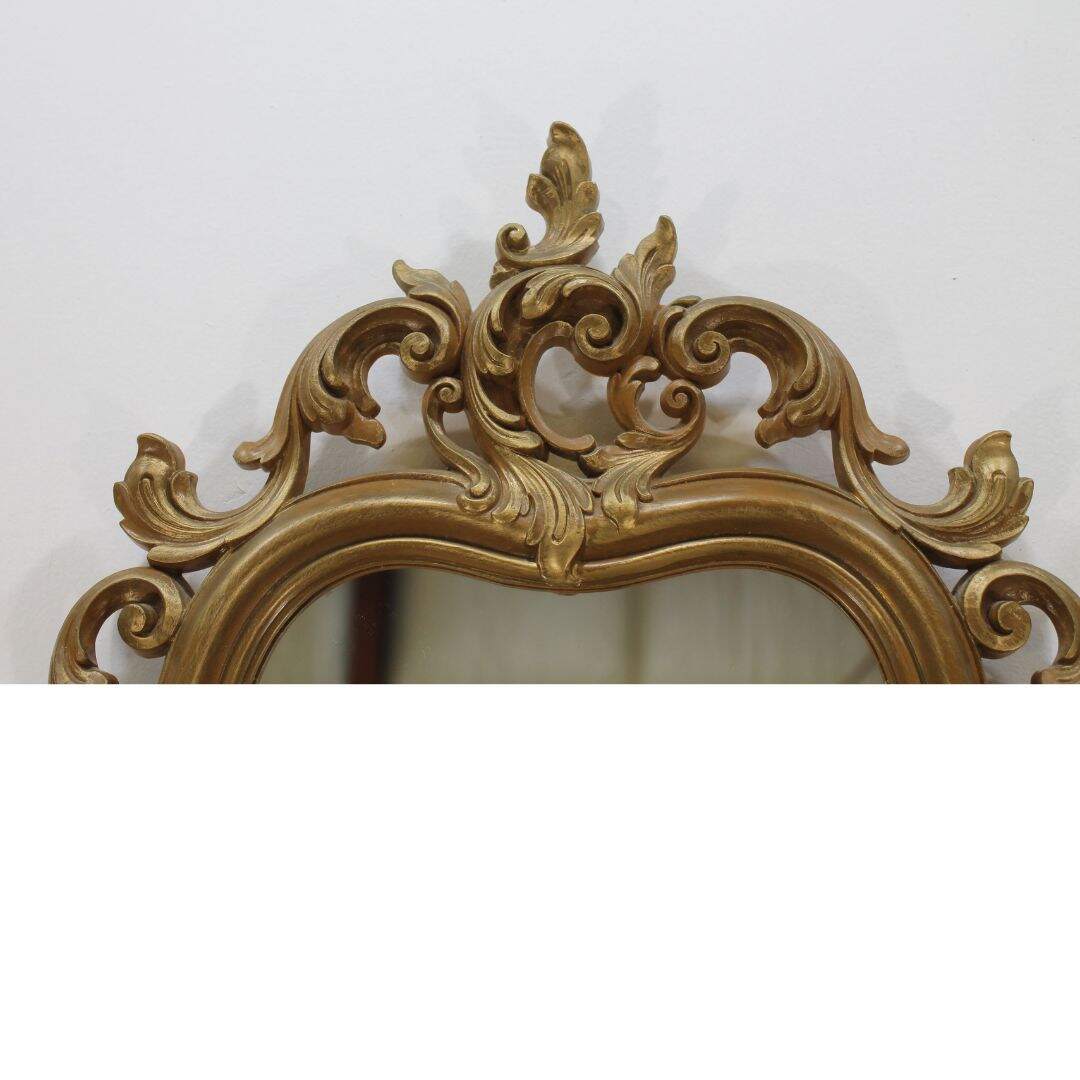 curvy ornate gold mirror