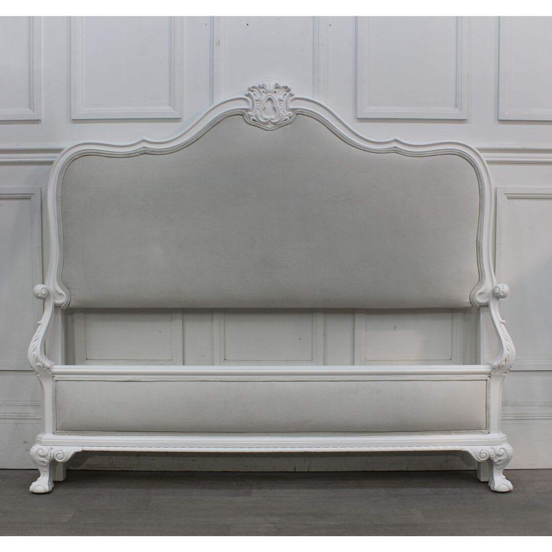 Double bed with carved frame and grey velvet