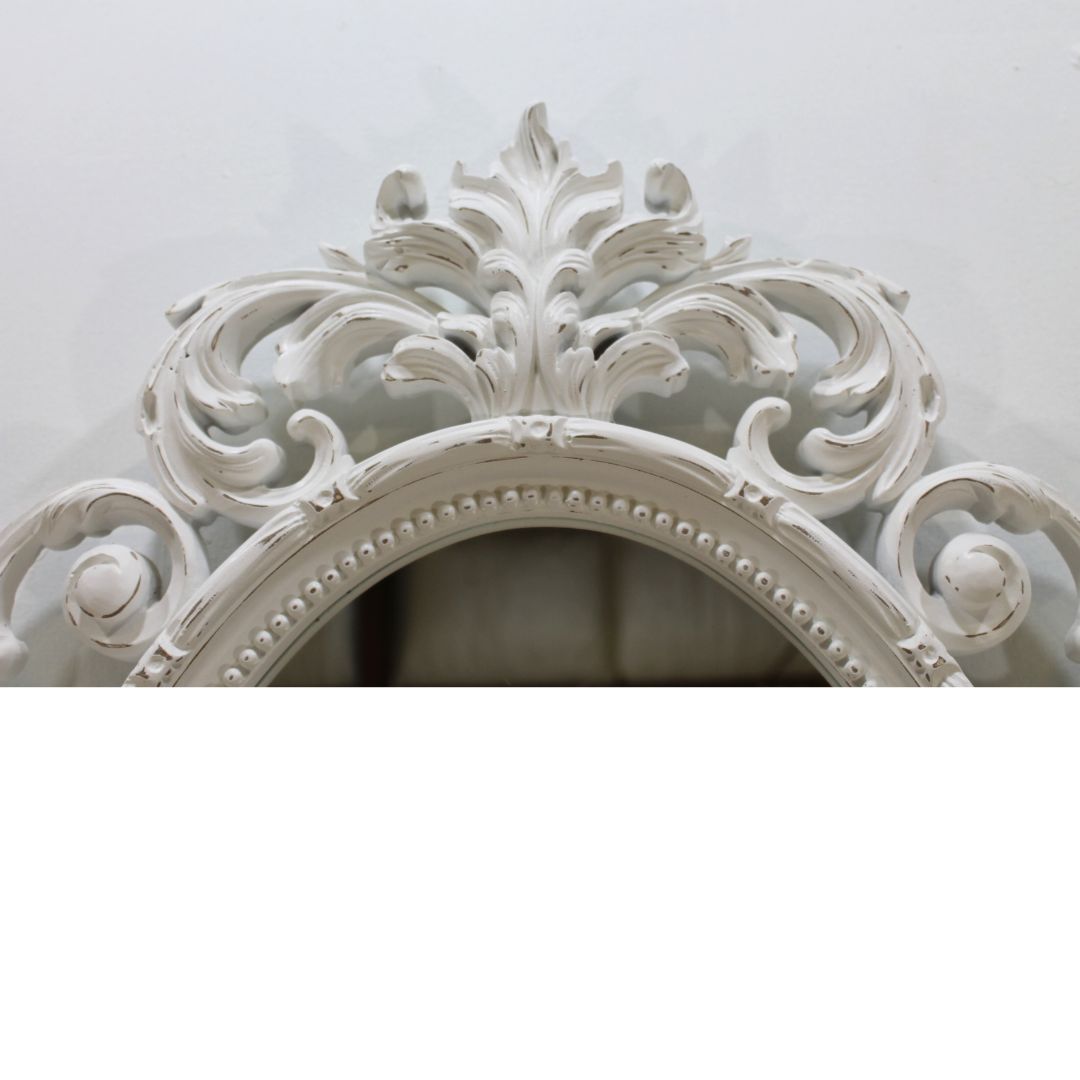 Ornate oval mirror