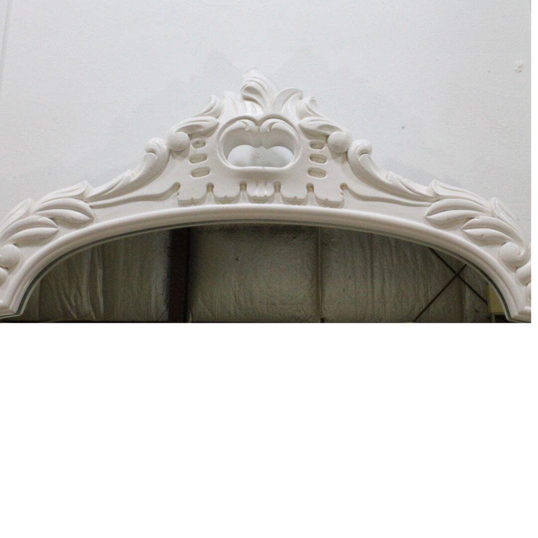 Ornate carved wooden mirror