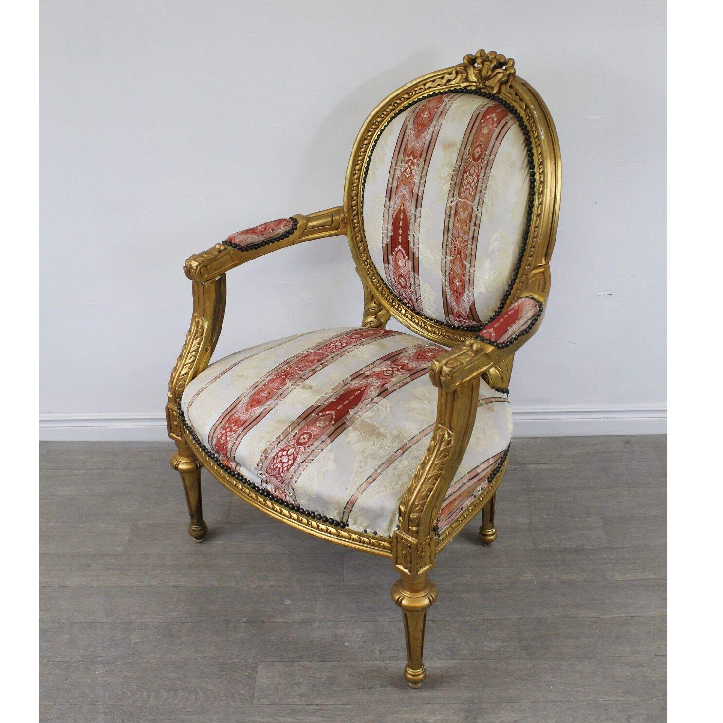 Pair of gold oval back chairs, unfinished