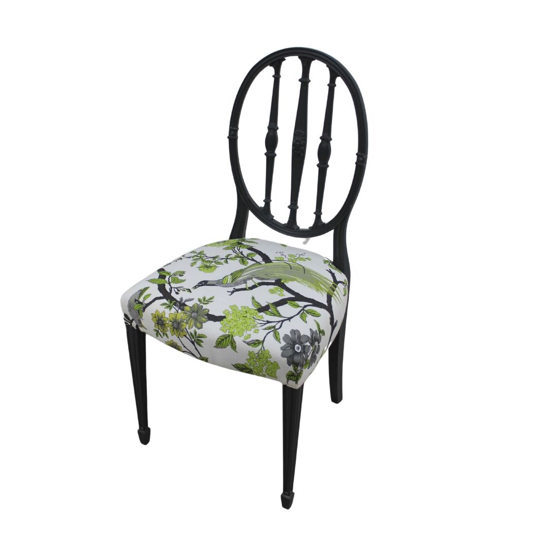 grey chair with bird fabric