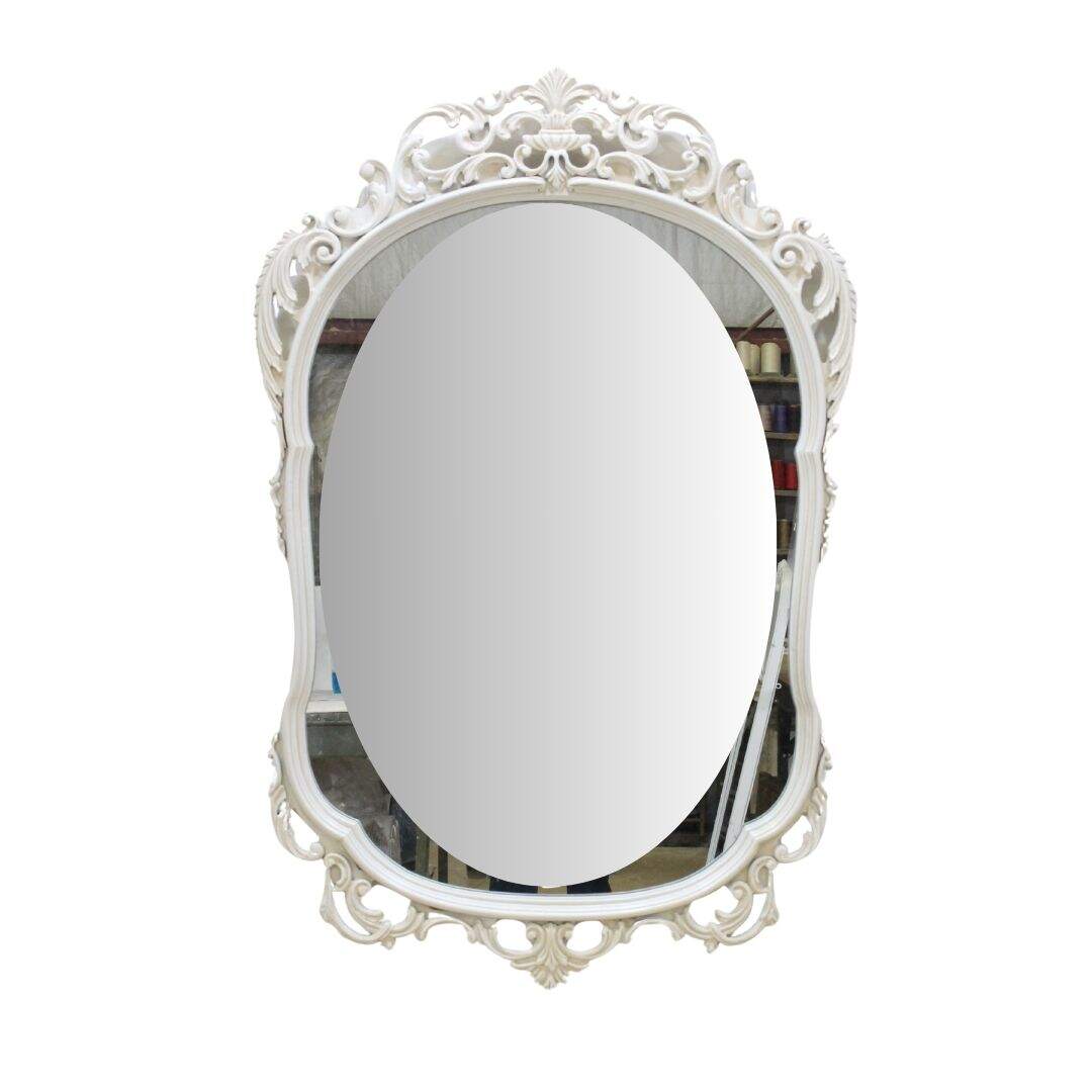 large ornate carved wooden mirror