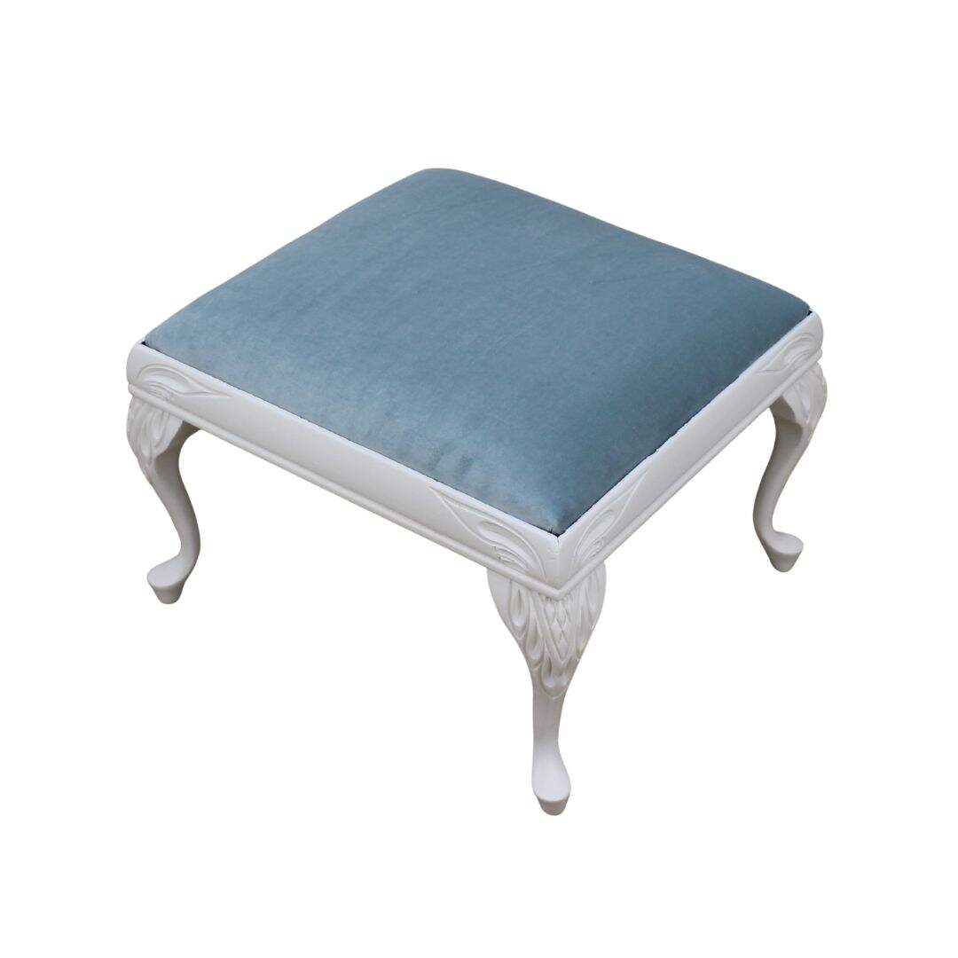 Ottoman with carved legs and pale blue velvet