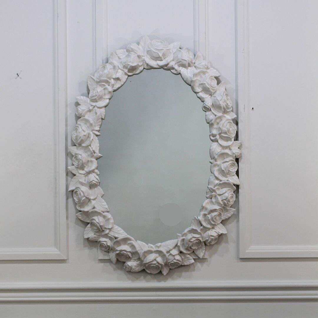 Oval mirror with roses on frame