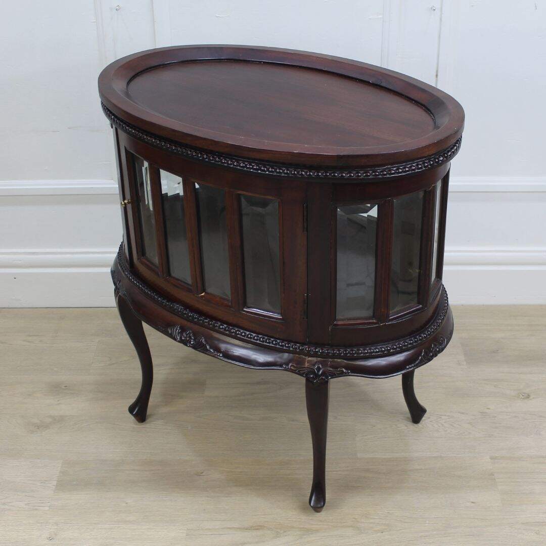 Oval tea serving cabinet with tray top