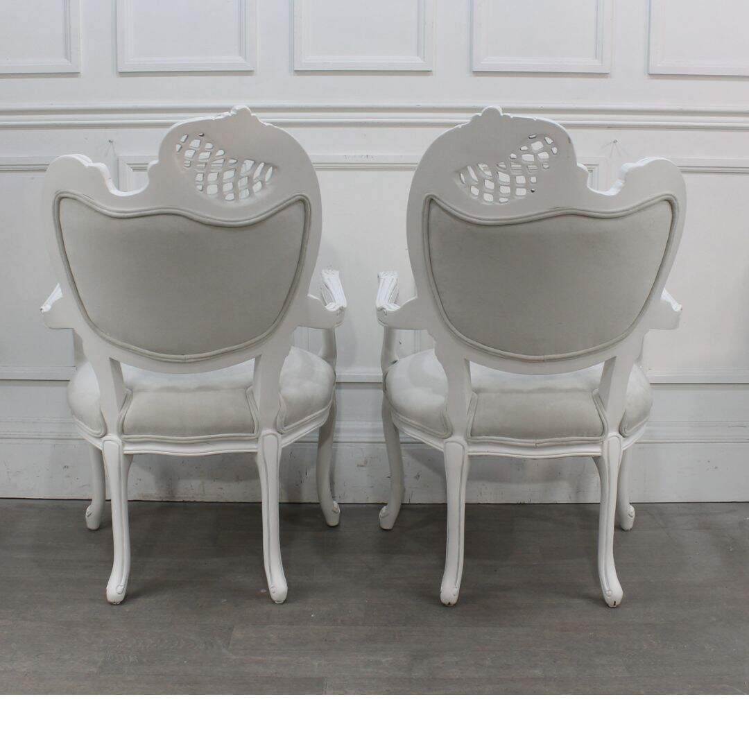 Pair of asymmetrical chairs with tufting