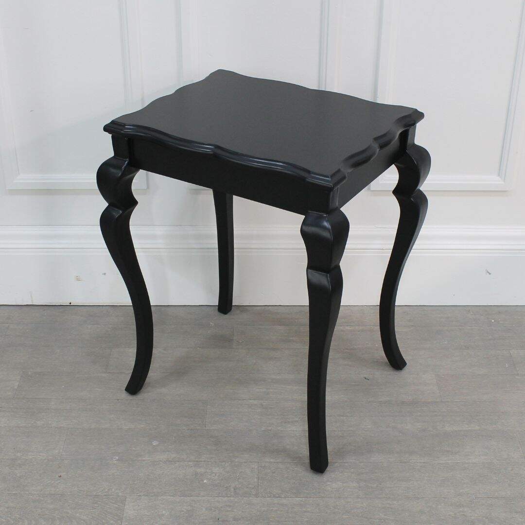 Pair of black side tables with curvy legs