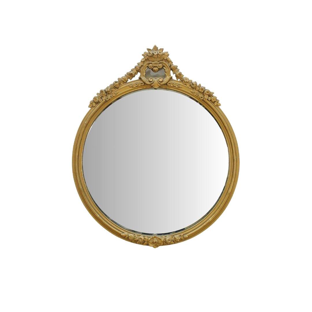 round gold mirror with floral swag detail
