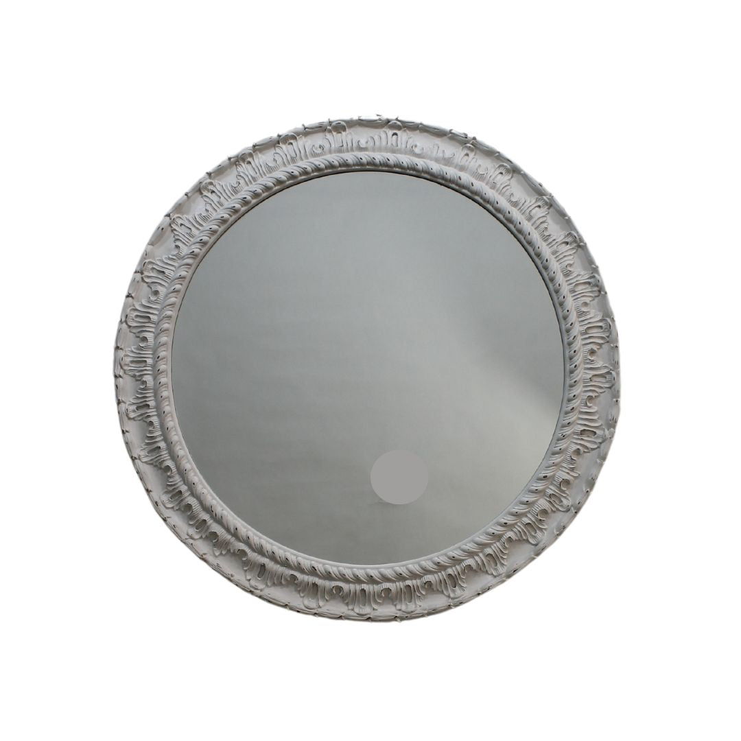 Round mirror with ornate frame