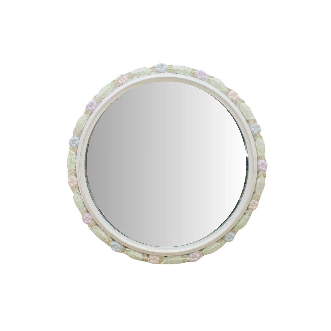 round mirror with pastel flower details