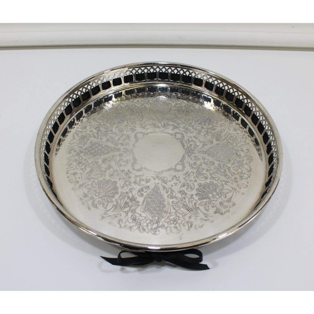 round silver plated tray with black ribbon