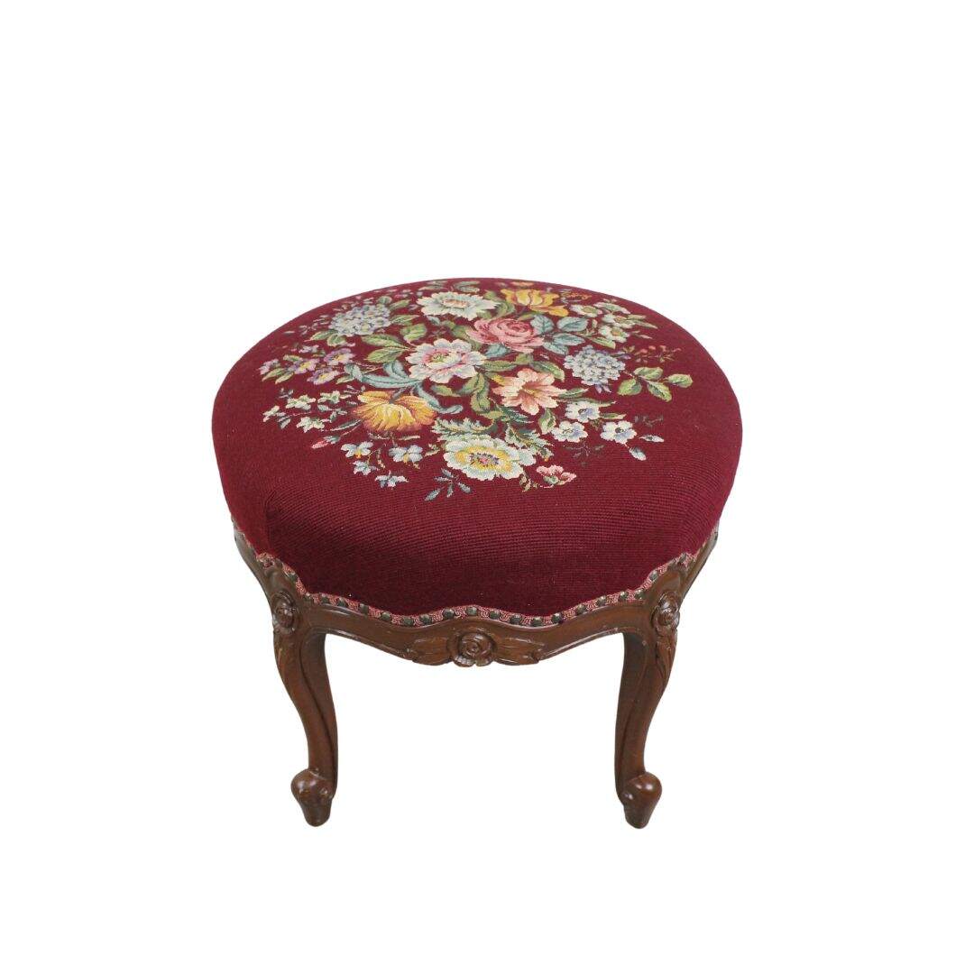 Round footstool with carved legs, unpainted