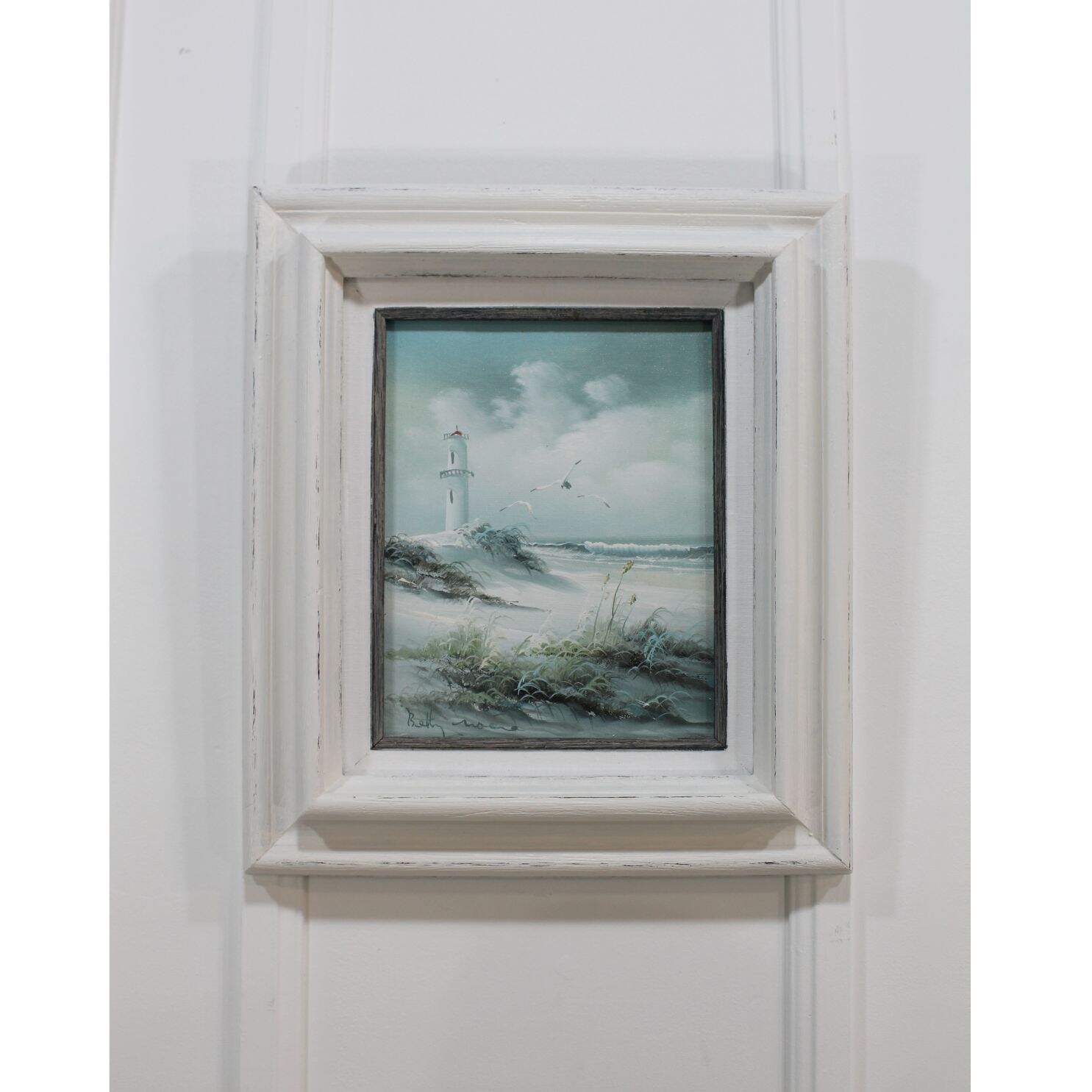 Vintage oil painting of a beach scene with a grey frame