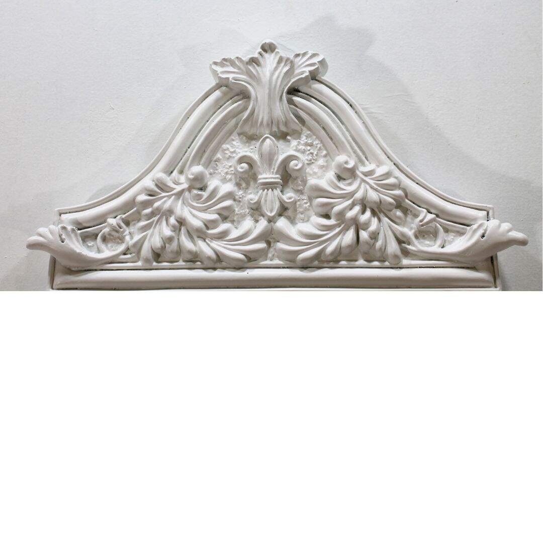 white mirror with fleur de lis detail