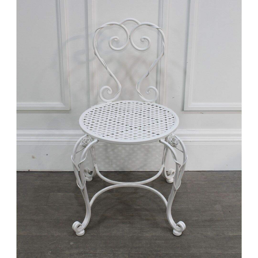 Ornate white wrought iron chair