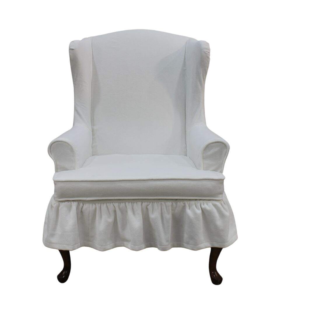 Wing chair with white velvet slipcover