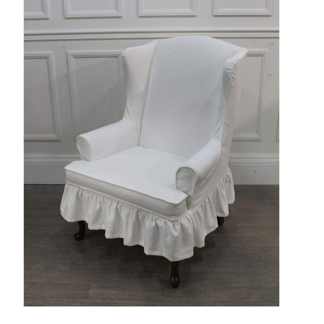 Wing chair with white velvet slipcover