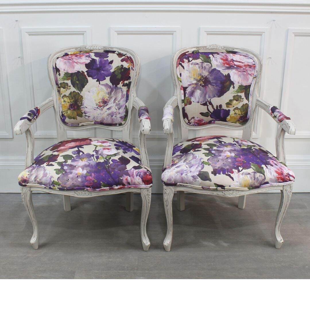 Pair of floral bergere chairs with floral fabric